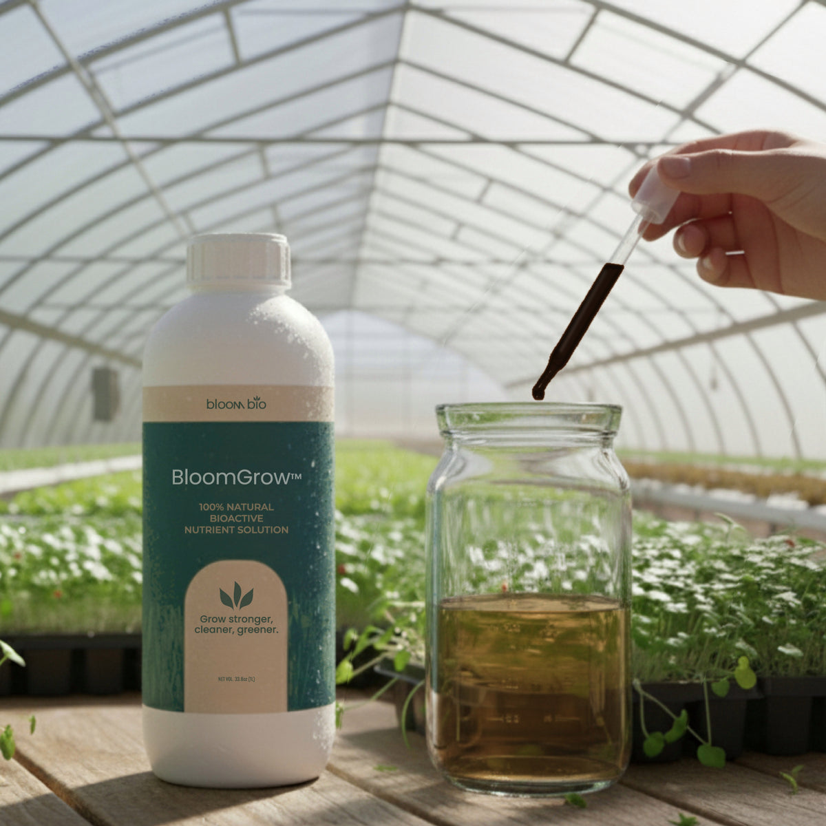 BloomGrow 1 L bottle beside a jar of dosed water in a greenhouse